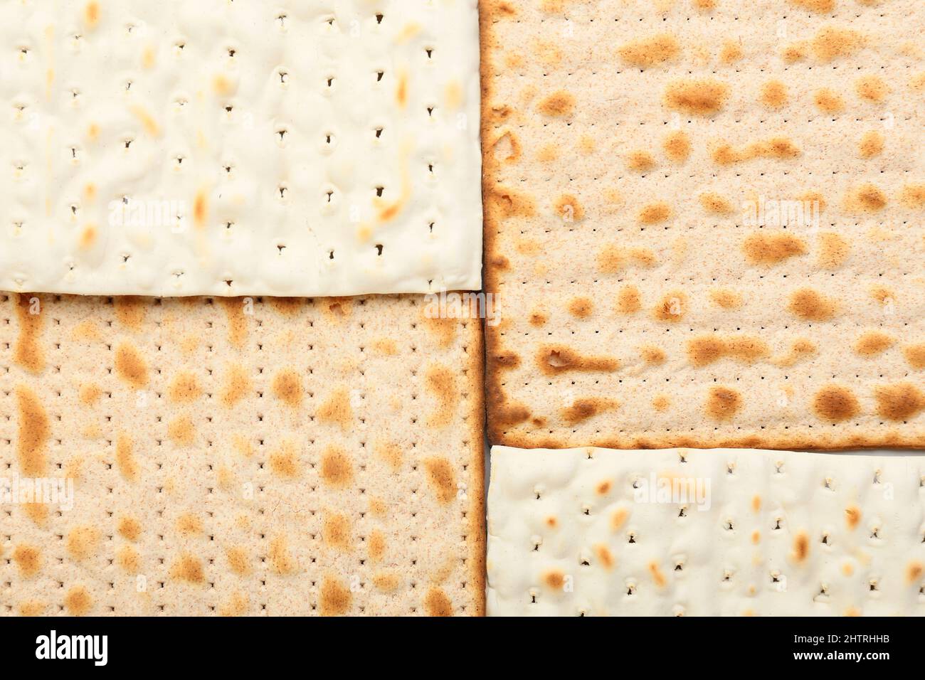 Traditional Jewish flatbread matza for Passover as background, closeup