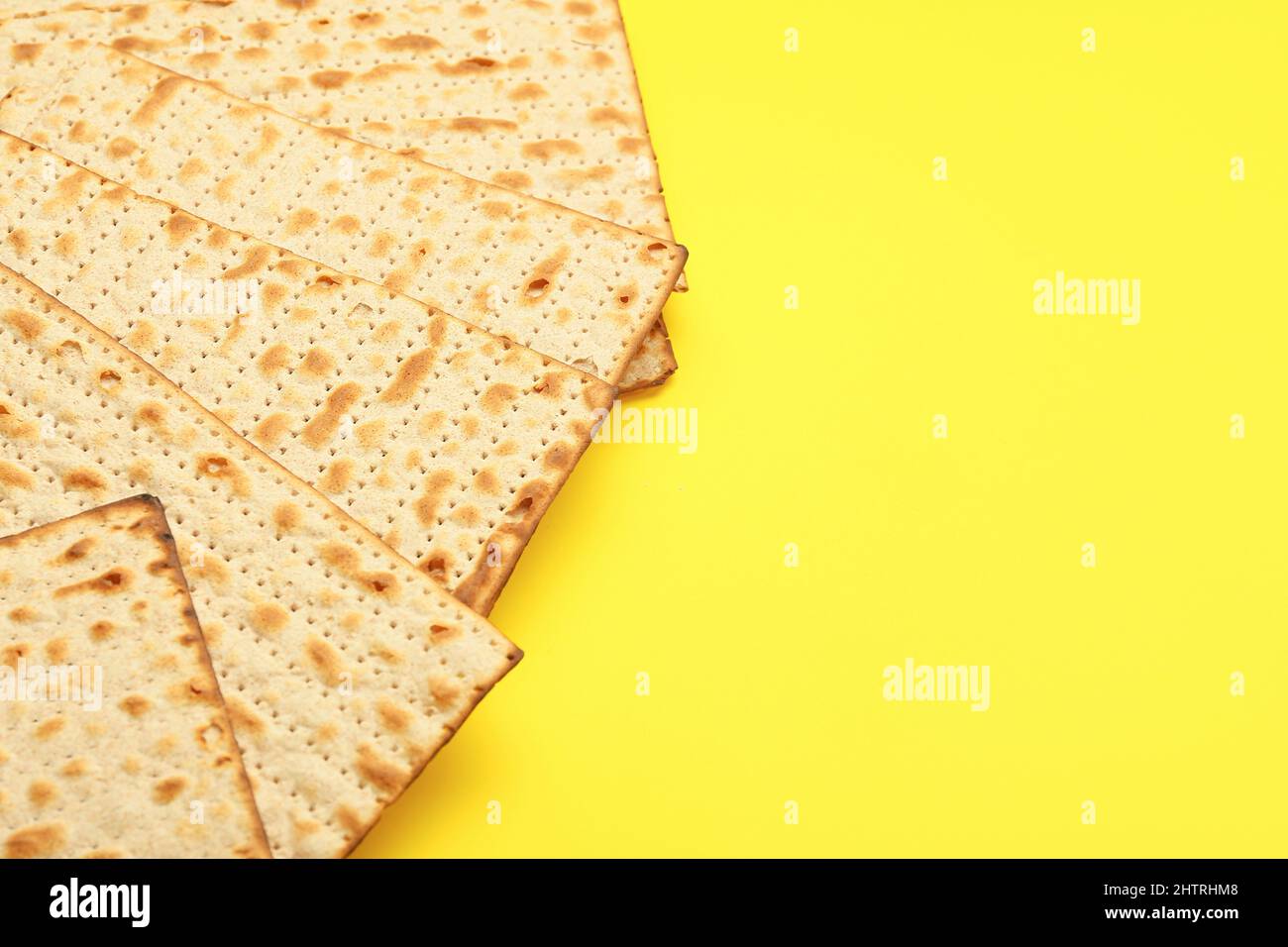 Jewish flatbread matza for Passover on yellow background, closeup Stock Photo Alamy