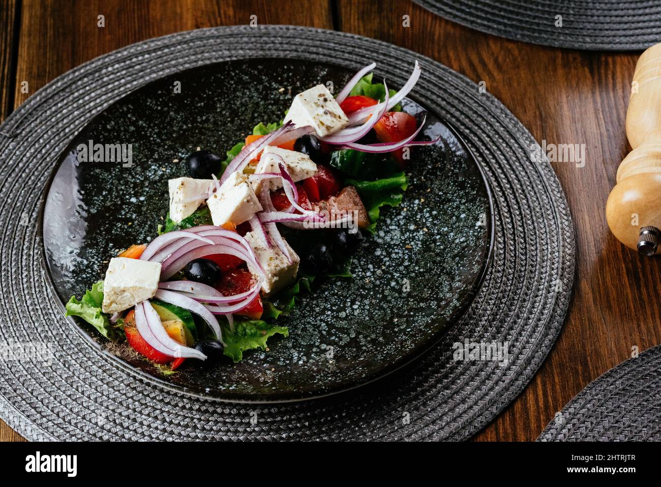 greek salad on a gray plate. restaurant menu Stock Photo