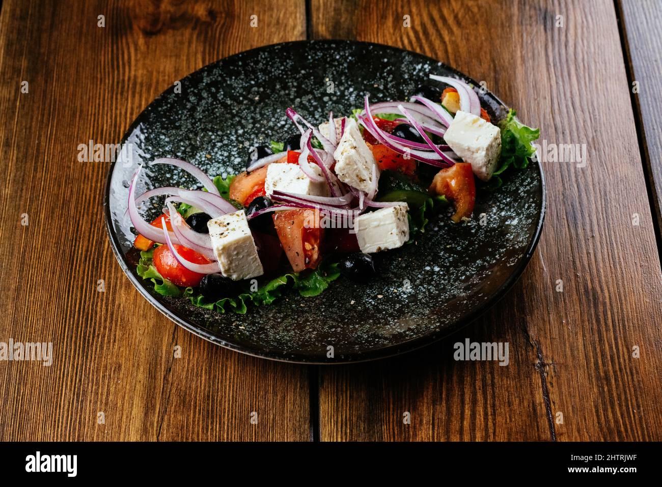 greek salad on a gray plate. restaurant menu Stock Photo