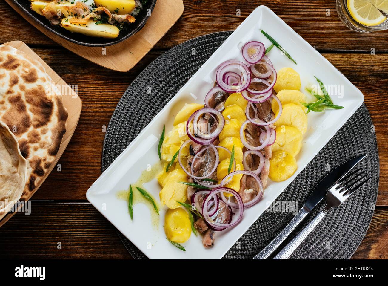 boiled potatoes and pickled herring. restaurant menu Stock Photo Alamy