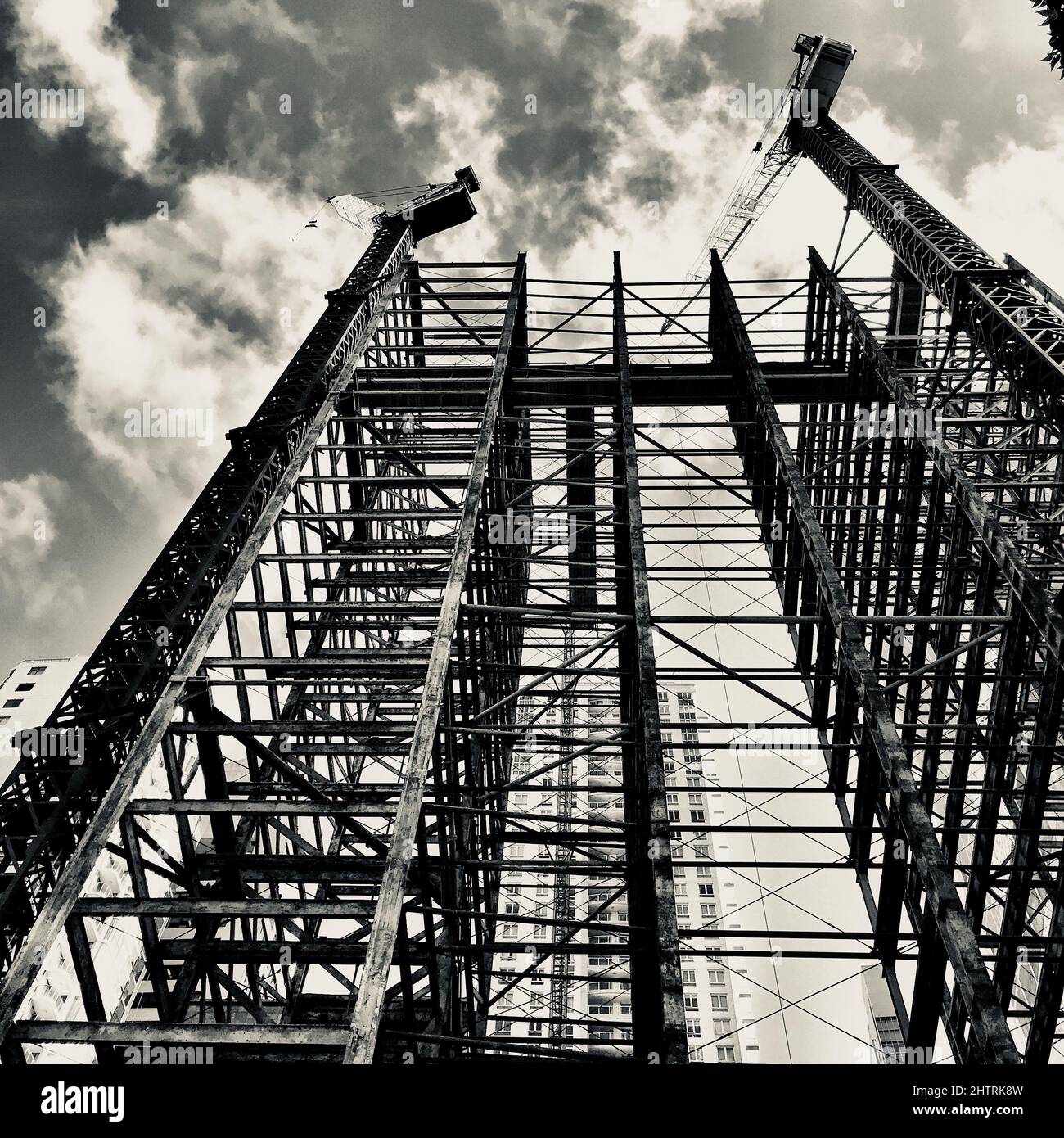 A low angle shot of facade of a building under construction in black ...