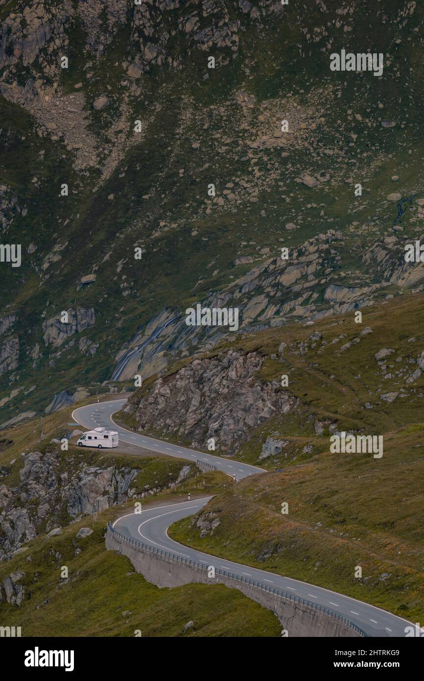 Empty paved mountain road winding through the landscape. Stock Photo