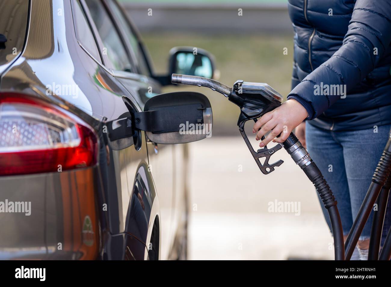 Process of refueling a car fill with petrol fuel at the gas station