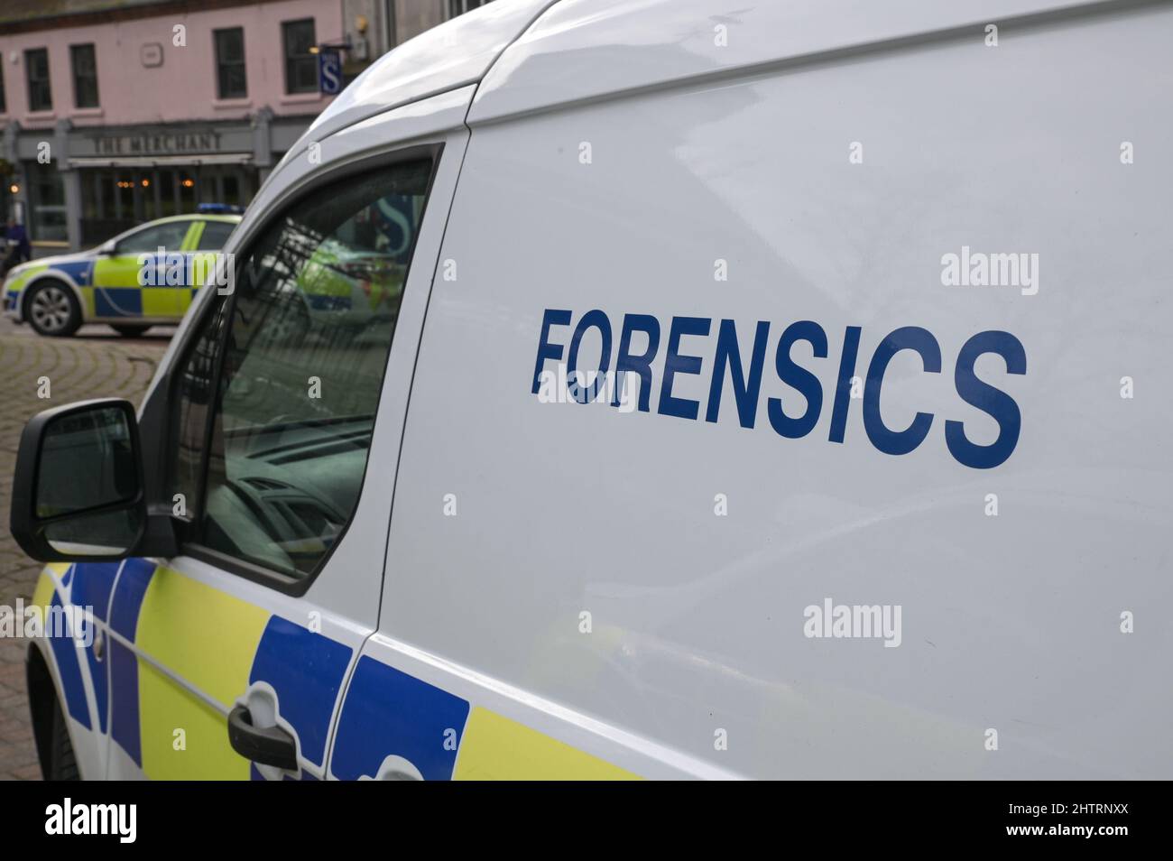British Police forensics vehicles at a crime scene in the UK, England