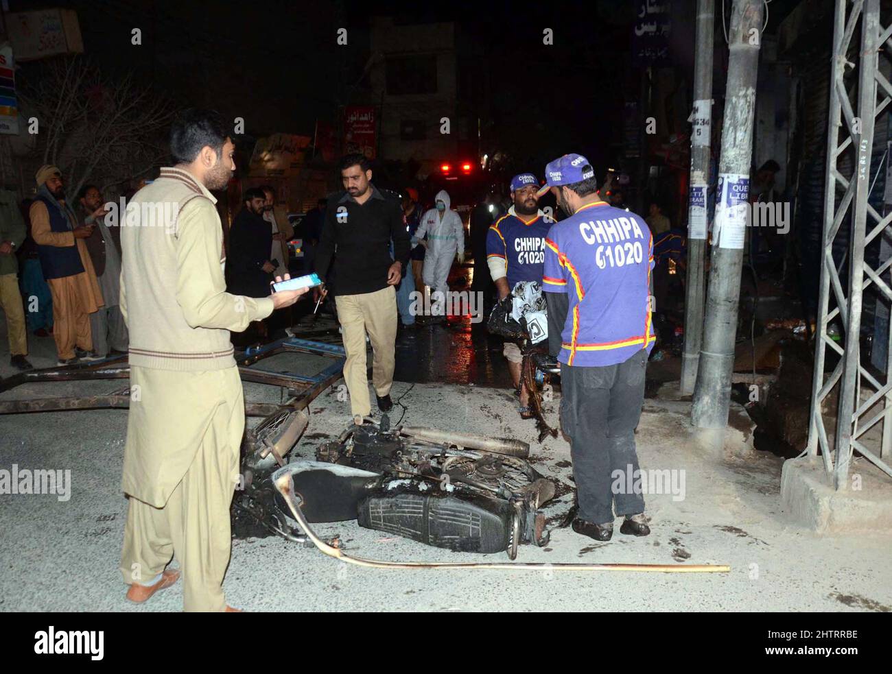 View of venue while security officials are cordon off the site for inspection and rescue operation is underway after a blast located on Fatima Jinnah road in Quetta on Wednesday, March 02, 2022. At least 25 people were injured and two people were killed after a blast struck Quetta's Fatima Jinnah Road. The blast took place near a police mobile and soon after the explosion, nearby shops caught fire. The Deputy Inspector-General (DIG) Quetta confirmed that a person has been illed in the blast while more than 10 have been injured. Stock Photo