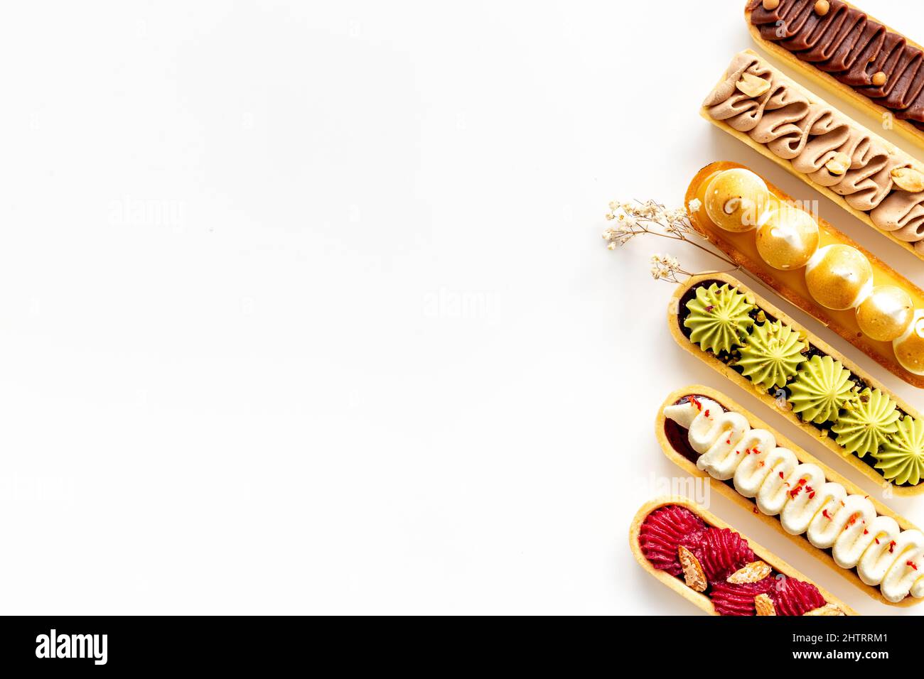 Sweet food pattern of eclairs with color topping. Sweet shacks Stock ...