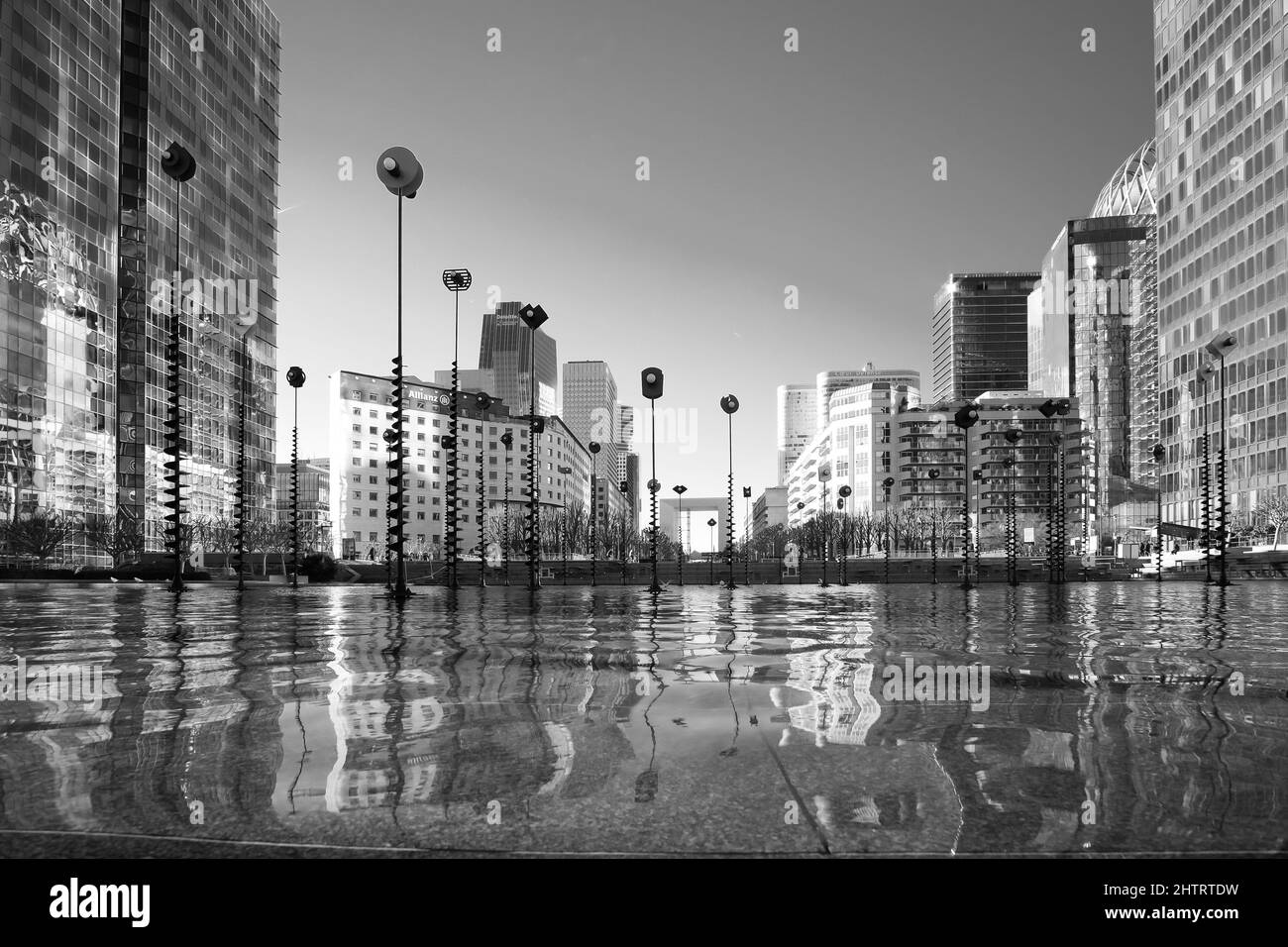 Paris, France - February 27, 2022 : A pool of water decorated with art at the famous business district La Défense in Paris in black and white Stock Photo