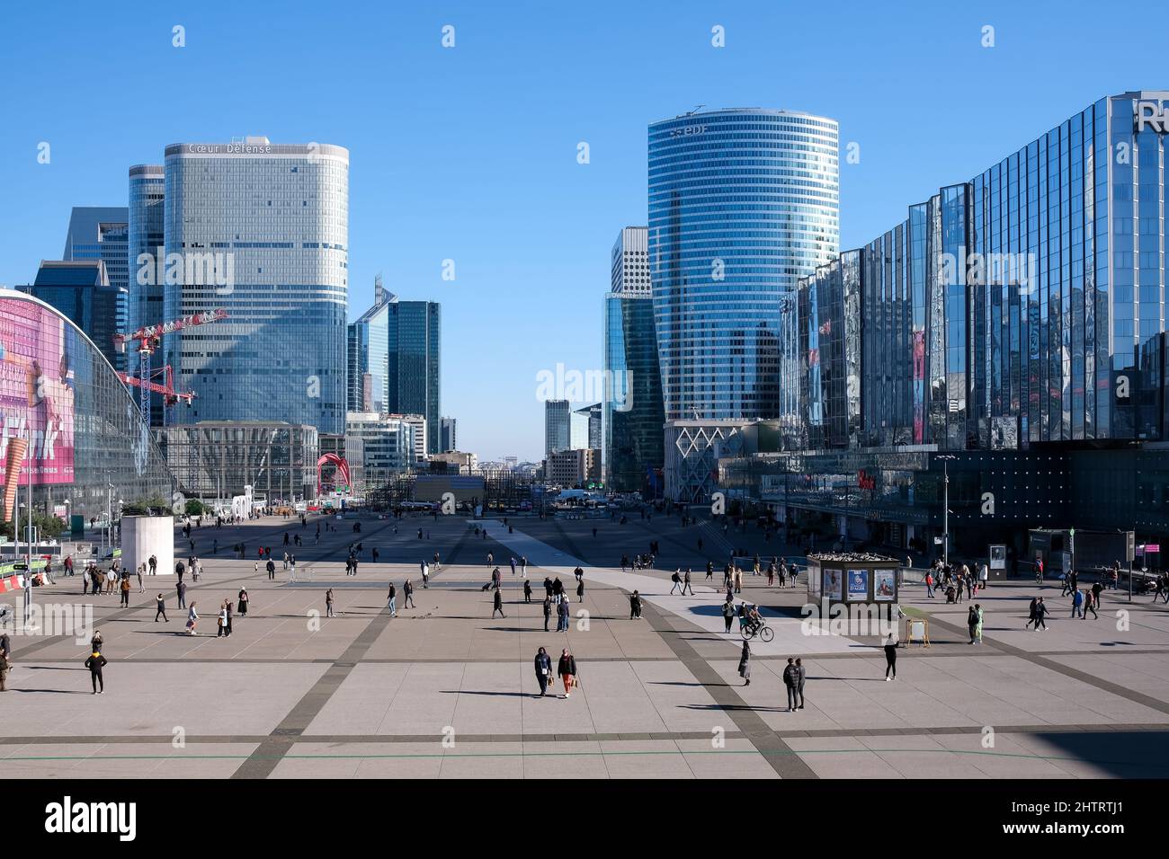 Paris, France - February 27, 2022 : People walking through the major business district La Défense in Paris Stock Photo