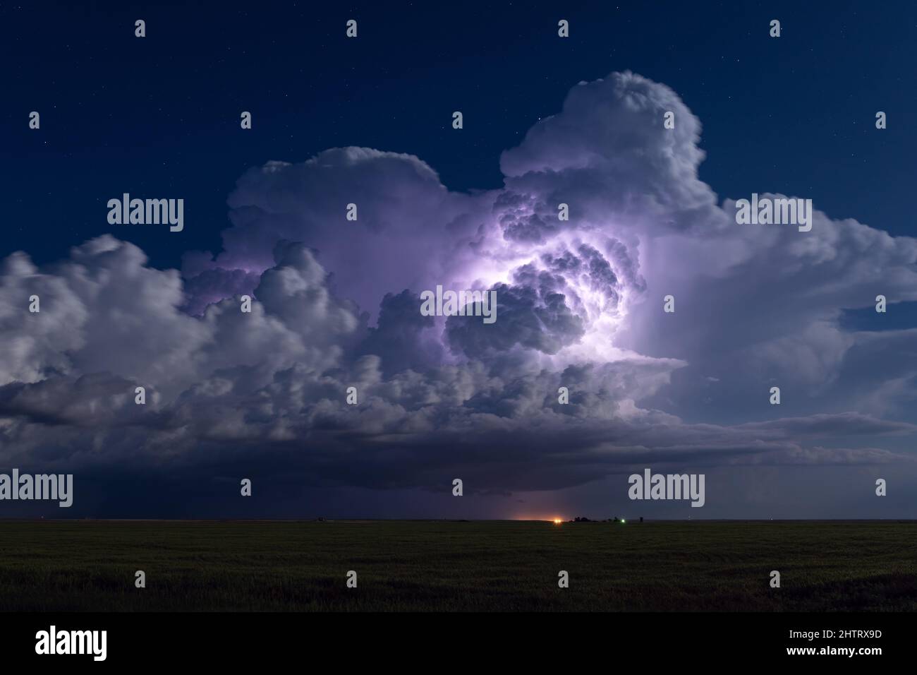 Thunderstorm cumulonimbus clouds illuminated by lightning near Jetmore, Kansas, USA Stock Photo