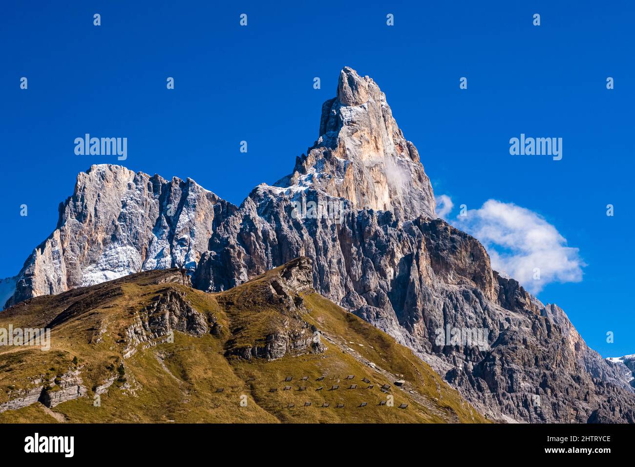 Cima di Vezzana (left) and Cimon della Pale (right), two of the main summits of the Pala group, seen from above Rolle Pass in autumn. Stock Photo