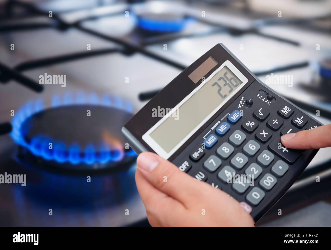 Gas kitchen stove cook with blue flames burning. Panel from steel with