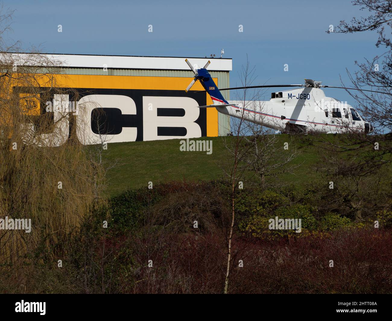 Helicopter landed at JCB World Headquarters in Rocester, Staffordshire Stock Photo