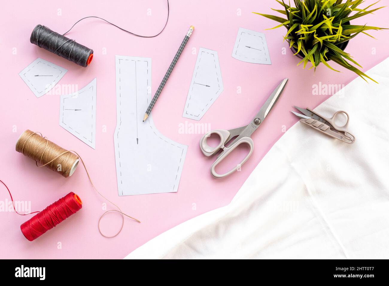 Sewing patterns with fabric - fashion designer table with tailor tools ...