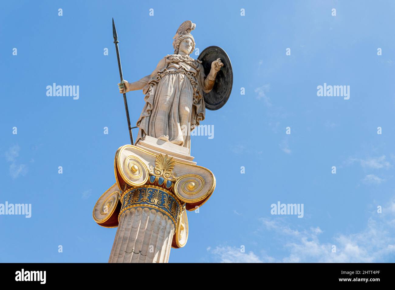 Athens, Greece. Column statue of godess Athena, one of the Olympian deities in classical Greek religion, in the modern Academy of Athens Stock Photo