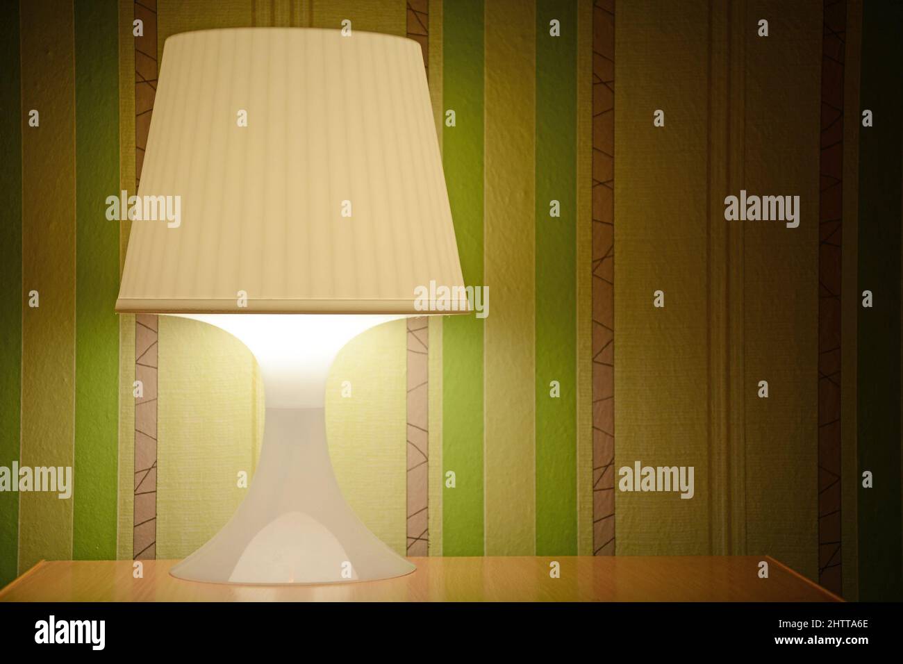 Lamp with green wallpaper background Stock Photo - Alamy