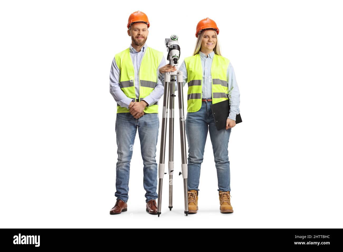 Male and female geodetic surveyors posing with a measuring station isolated on white background Stock Photo