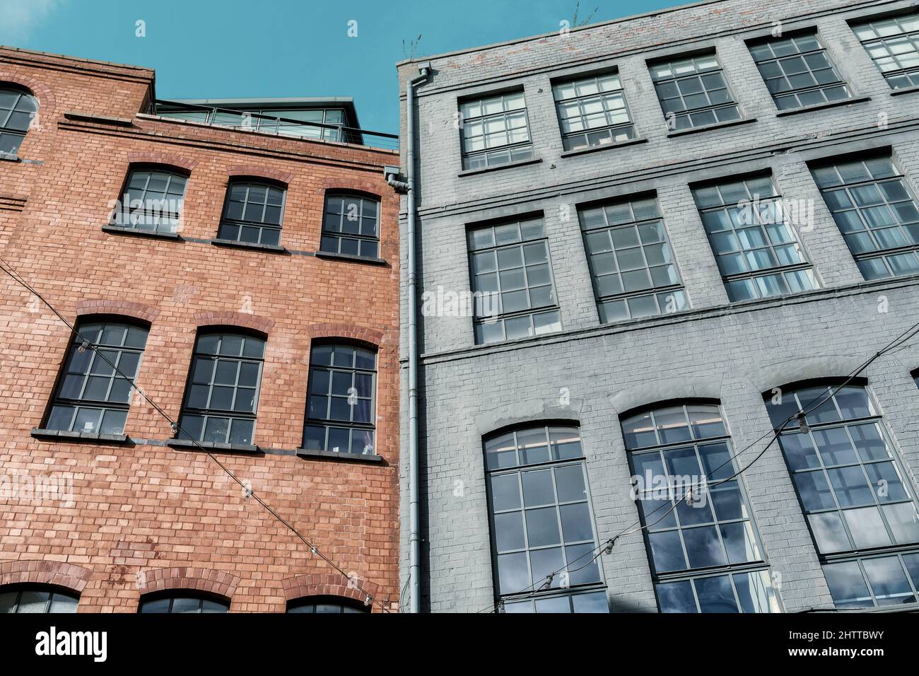 Victorian factory buildings with their large metal framed windows now repurposed for creative enterprises and such like in Deritend, Birmingham, UK. Stock Photo