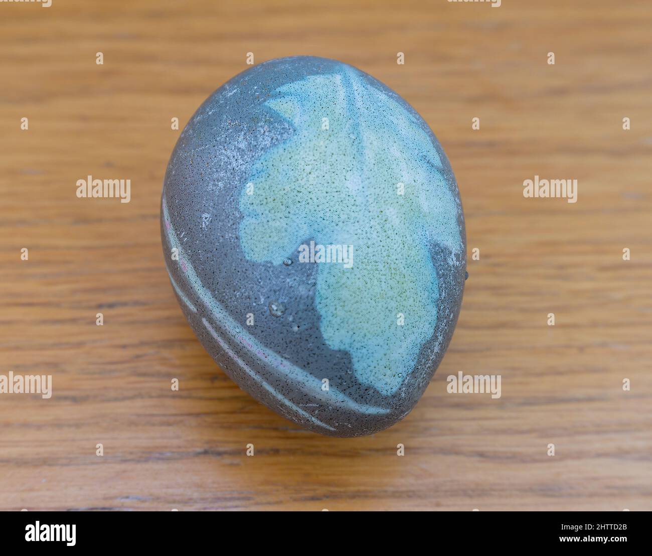 Stockholm, Sweden - April 7, 2021: Eastern egg in special color with a leaf monster on it Stock Photo
