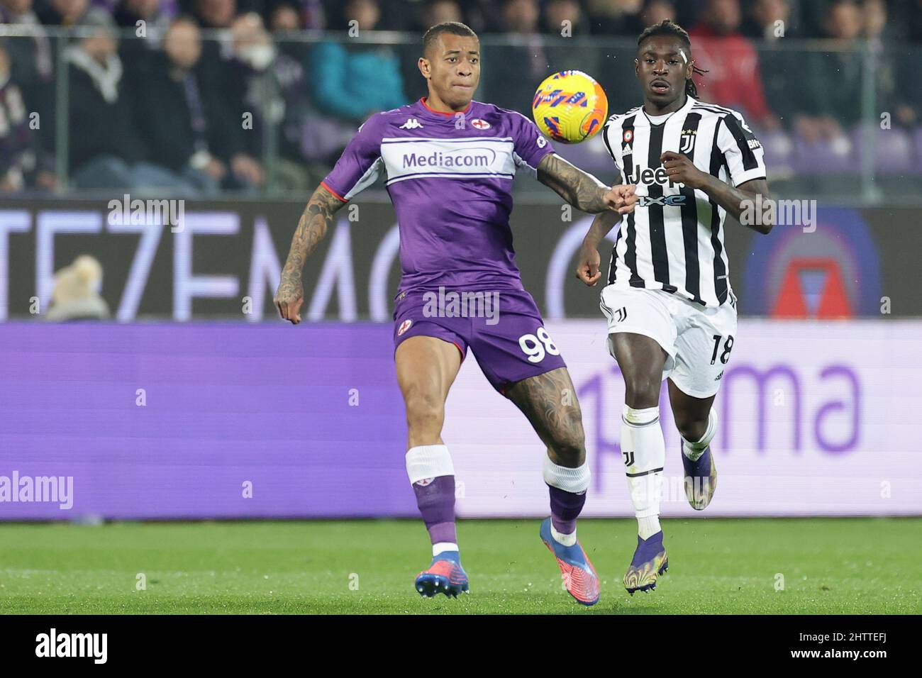 Florence, Italy. 21st May, 2022. Moise Kean of Juventus FC and Nikola  Milenkovic of ACF Fiorentina compete for the ball during the Serie A  2021/2022 football match between ACF Fiorentina and Juventus