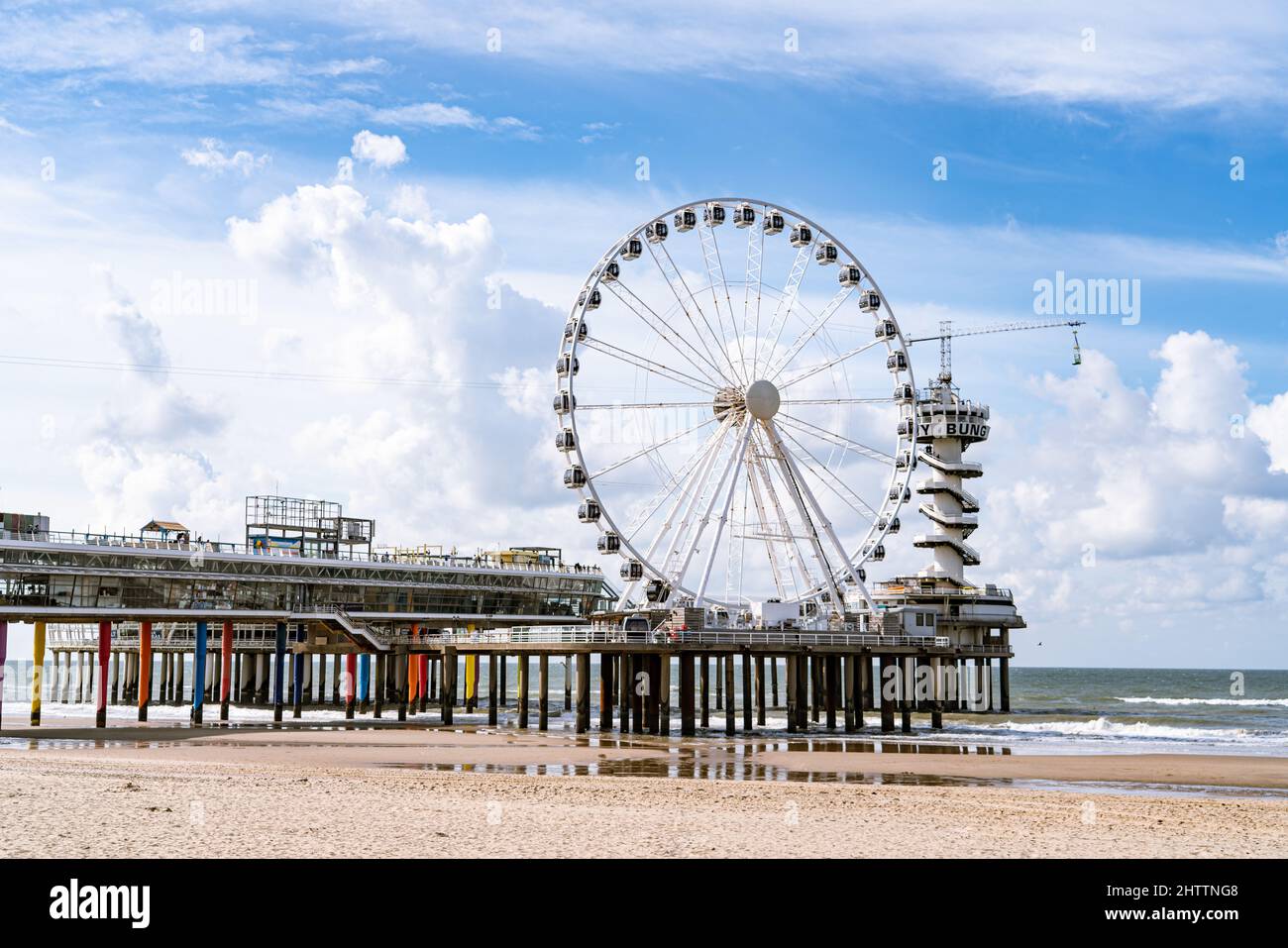 Closeup of a Ferris wheel with bright cloudy sky background Stock Photo ...