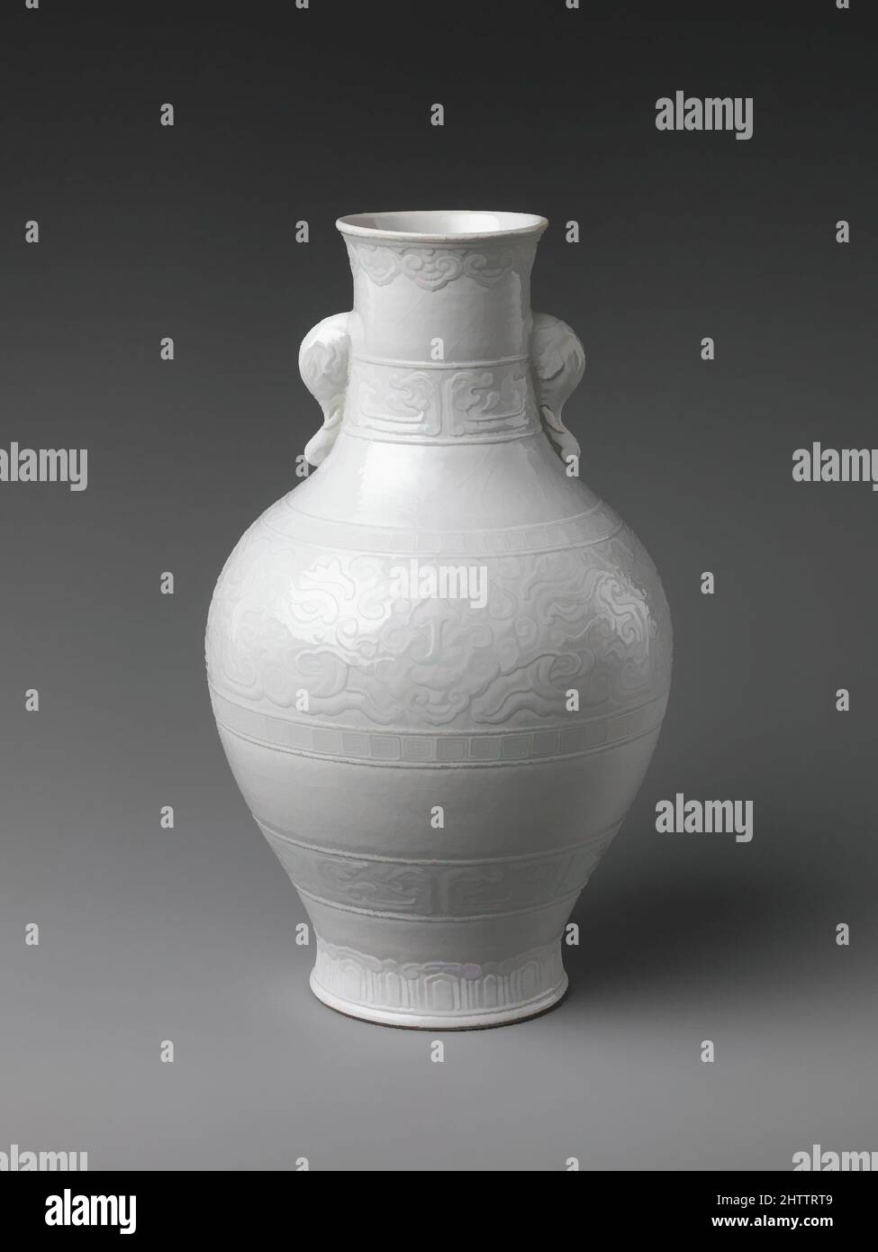 Art inspired by Vase with Elephant Heads and Cloud Designs, Qing dynasty  (1644–1911), Qianlong period (1736–95), China, Soft-paste porcelain with  incised and applied decoration (Jingdezhen ware), H. 10 in. (25.4 cm); Diam.