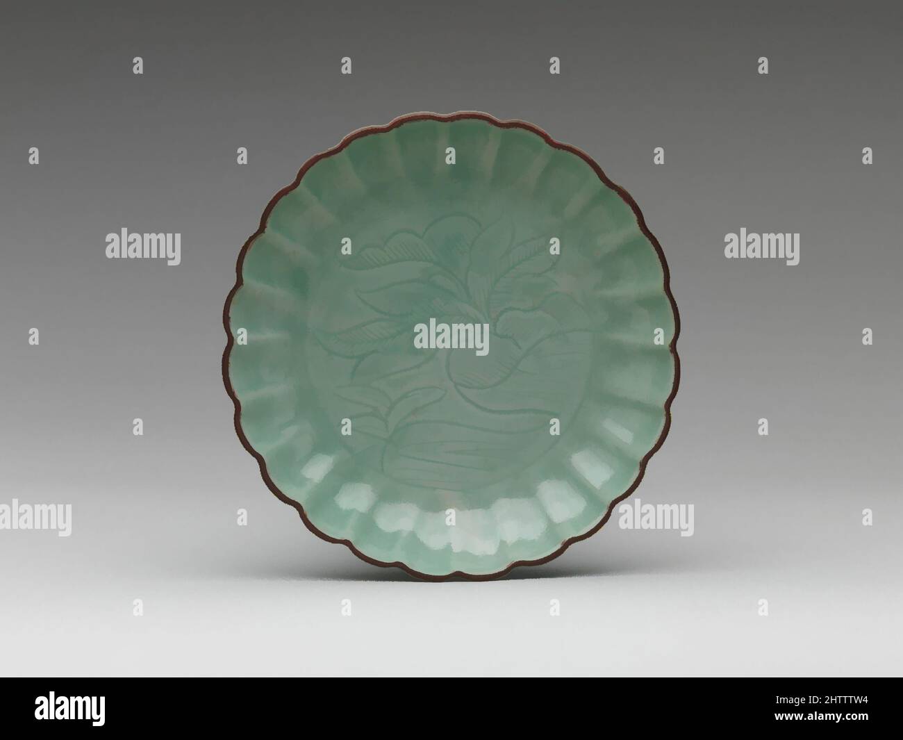 Art inspired by Dish with Vegetal Design, Edo period (1615–1868), mid-17th century, Japan, Porcelain with incised decoration under celadon glaze (Hizen ware; Imari type), H. 2 1/2 in. (6.4 cm); Diam. 8 7/8 in. (22.5 cm), Ceramics, Classic works modernized by Artotop with a splash of modernity. Shapes, color and value, eye-catching visual impact on art. Emotions through freedom of artworks in a contemporary way. A timeless message pursuing a wildly creative new direction. Artists turning to the digital medium and creating the Artotop NFT Stock Photo