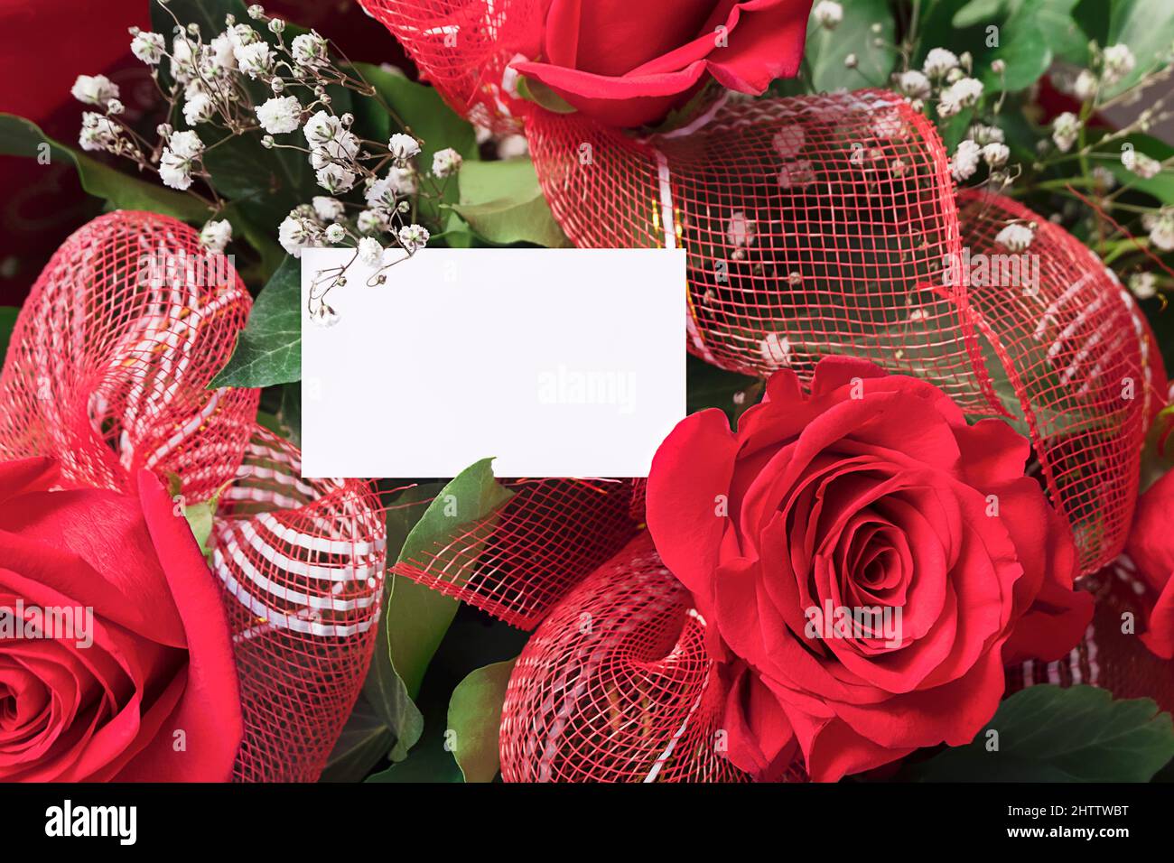 Blank greeting card with bouquet of red roses, mockup for your design Stock Photo