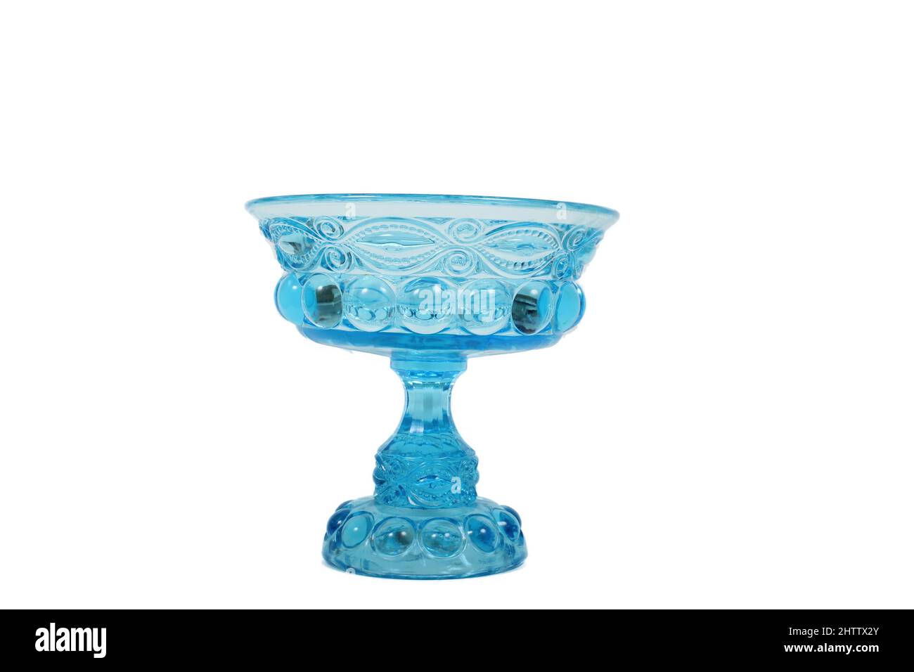 Antique Blue Glass Bowl With Swirl Pattern on White Background Stock Photo