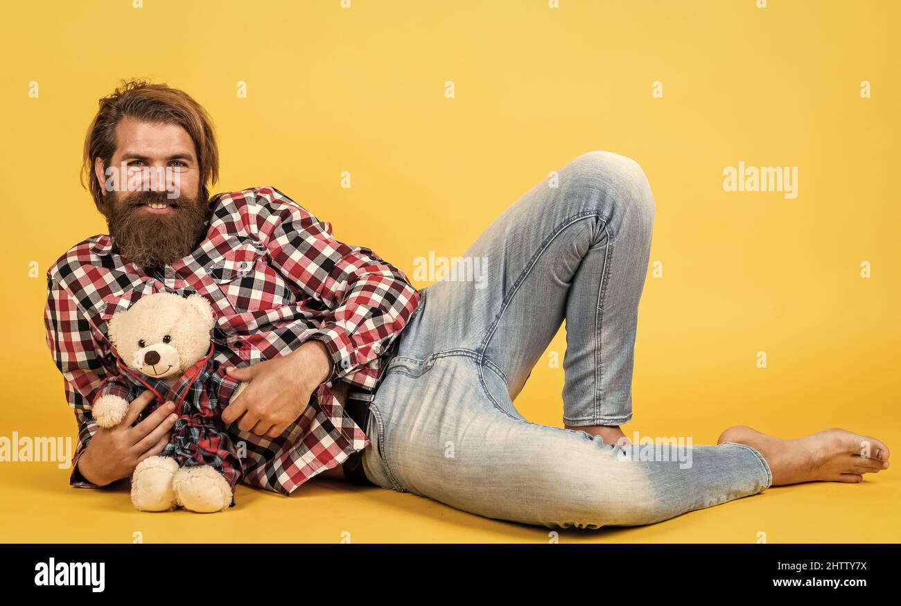 relaxation and joy. happy birthday. being in good mood. happy valentines day. cheerful bearded man hold teddy bear. male feel playful with bear Stock Photo
