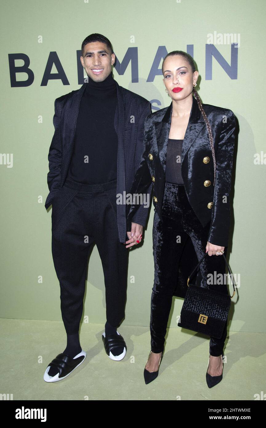 Achraf Hakimi and Hiba Abouk attending the Balmain Womenswear Fall