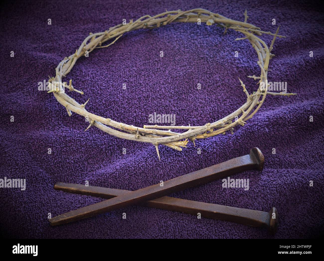 Nails and Crown of Thorns on Purple cloth (3B Stock Photo - Alamy
