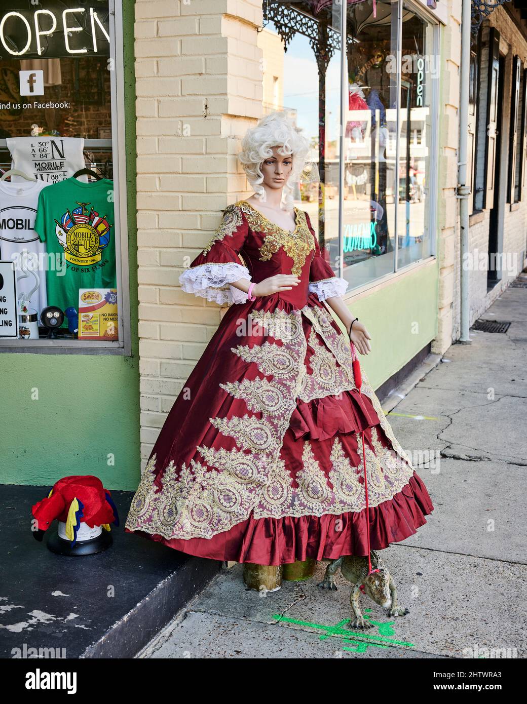 Female mannequin on a Mobile Alabama, USA, sidewalk dressed in Mardi Gras costume, dress outfit. Stock Photo