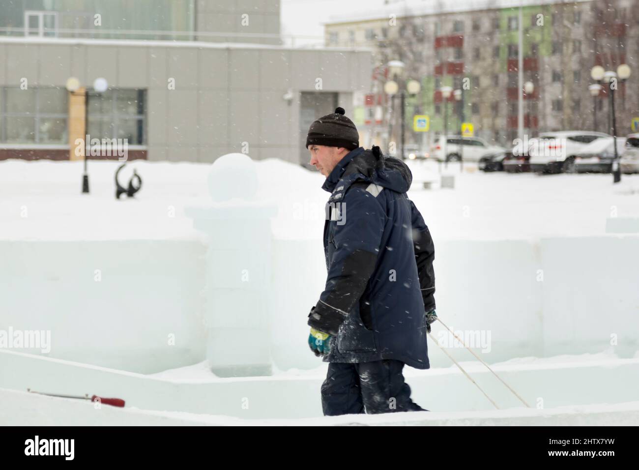 Ice Profiling Worker Portrait of a worker in a blue hooded jacket in profile at the ...
