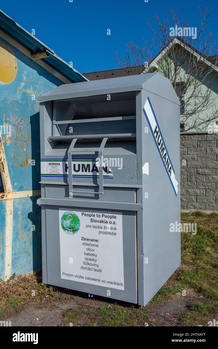 Nova Bana, Slovakia - Febuary, 27, 2022 : Humana container for used  clothing, shoes, bags, belts and textile. People helping other people  concept Stock Photo - Alamy