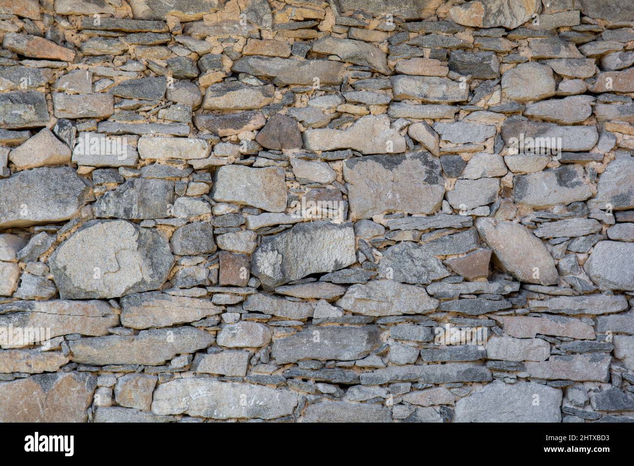 Old antique stone wall texture. Rocky Structure Backdrop. Background. Stock Photo