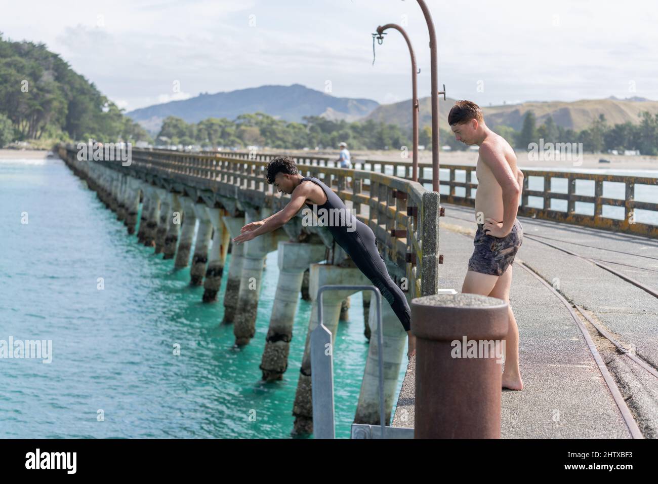 Tolaga Bay. New Zealand February 5 2022; One boy watches as another