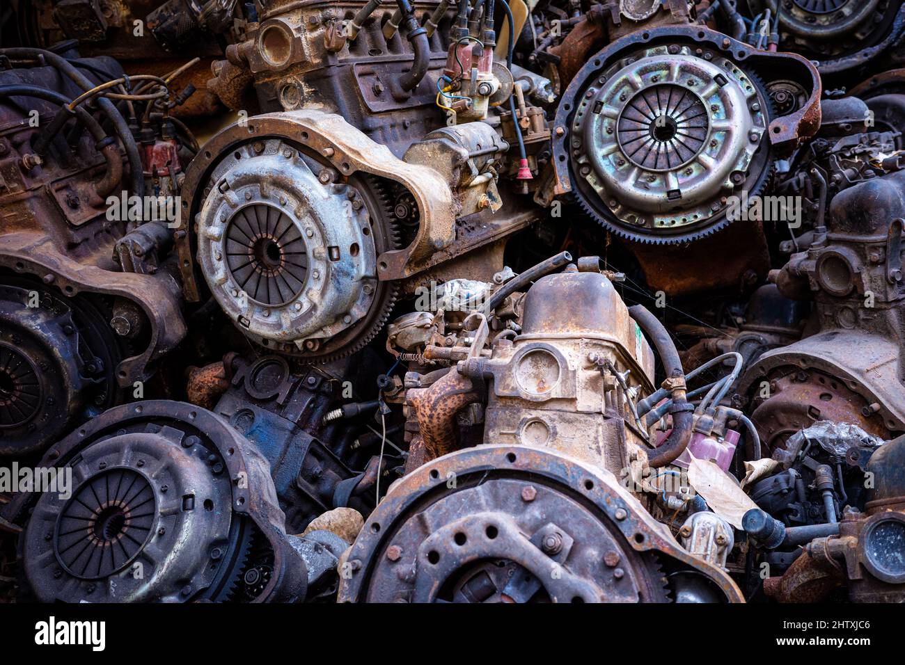 Pile of rusty and dirty obsoleted old vehicle metal engine and spare