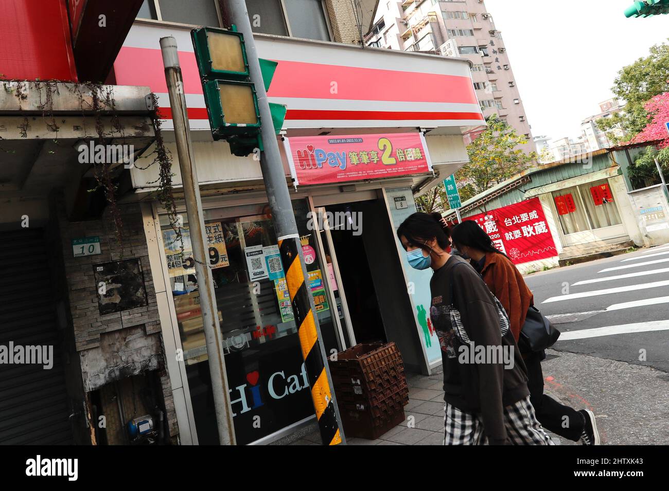 Taipei, Taipei, Taiwan. 3rd Mar, 2022. People walk pass as ...