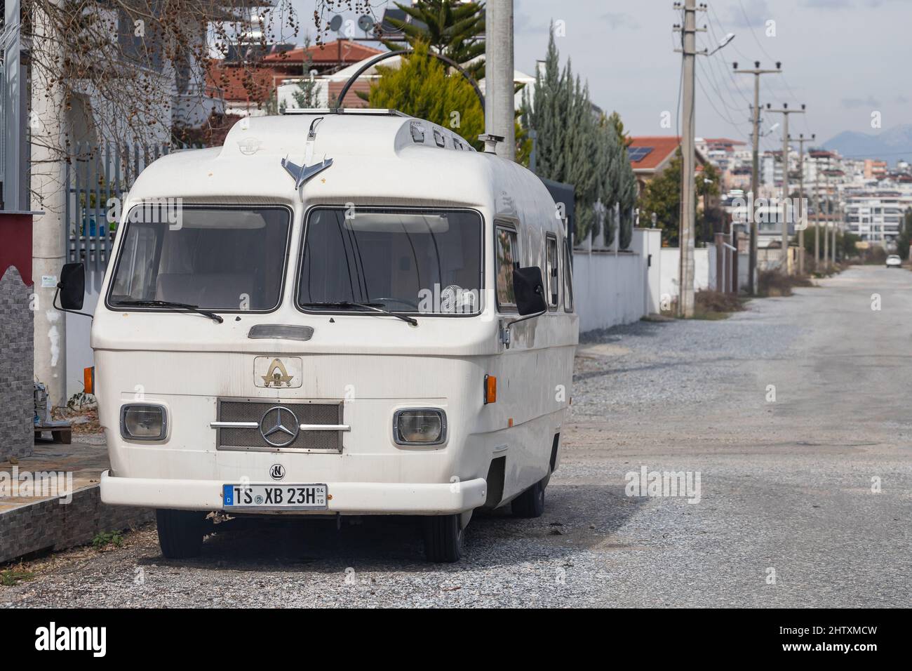 Side, Turkey -  February 13  , 2022: white  bus Mitsubishi  is parked  on the street on a warm summer day against the  road and trees Stock Photo