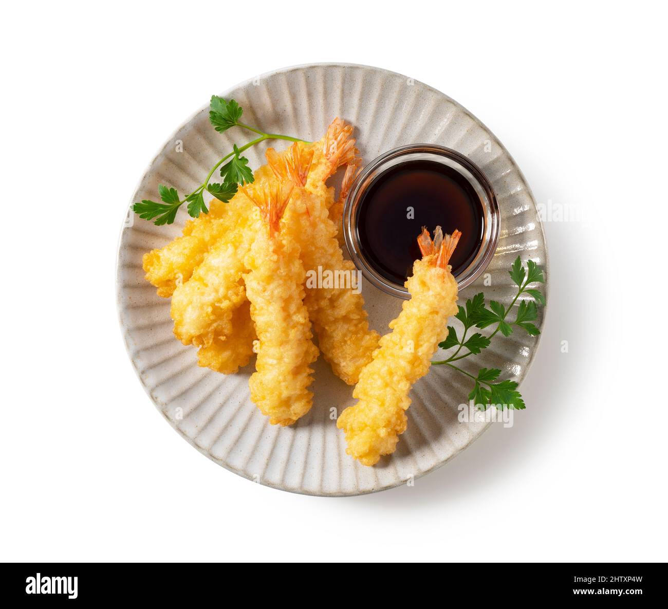 Shrimp tempura on a plate placed on a white background. Tempura is a