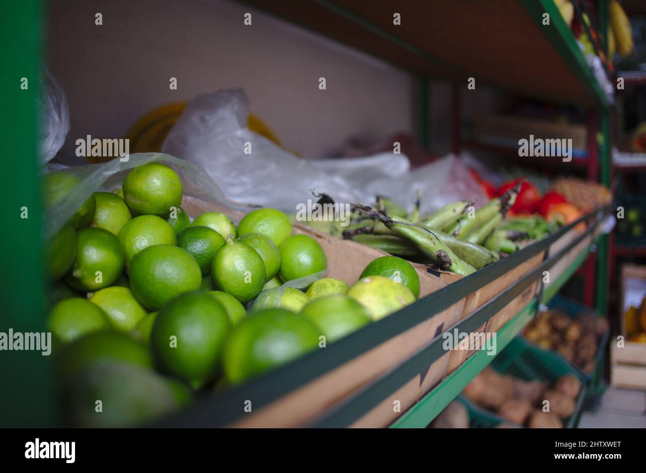 Box of limes at a fruit market Stock Photo Alamy