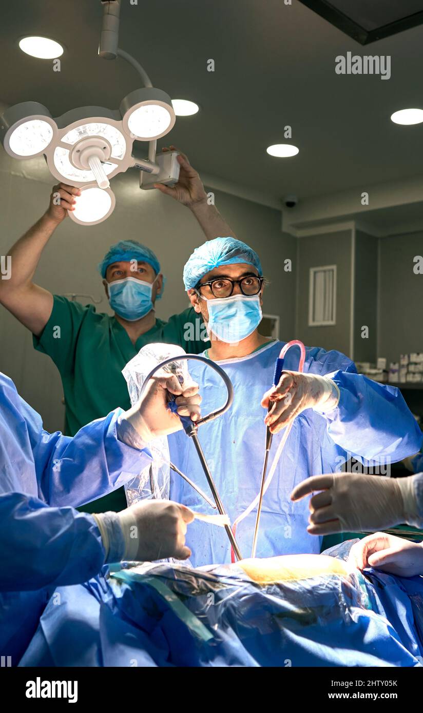 doctors in the operating room perform surgery on a patient Stock Photo ...