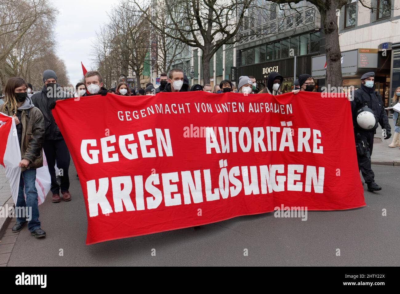 Demonstrators of the Left Party carry banner Against authoritarian crisis solutions, demonstration against compulsory vaccination and Corona measures Stock Photo