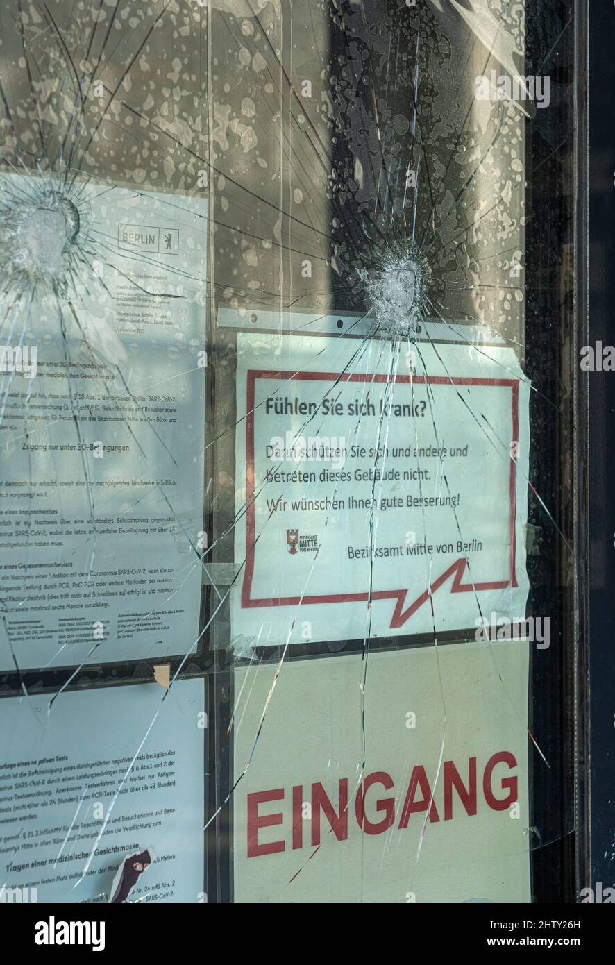 Broken window pane, vandalism at the entrance door to the Mitte town hall,  Berlin, Germany Stock Photo - Alamy