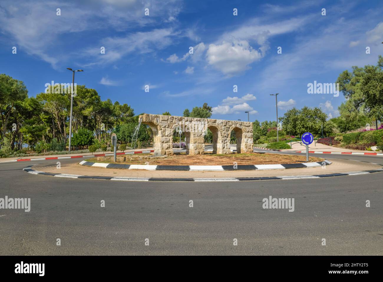 Fountain on a traffic island in the form of Aquaeduct, Caesarea, Israel Stock Photo