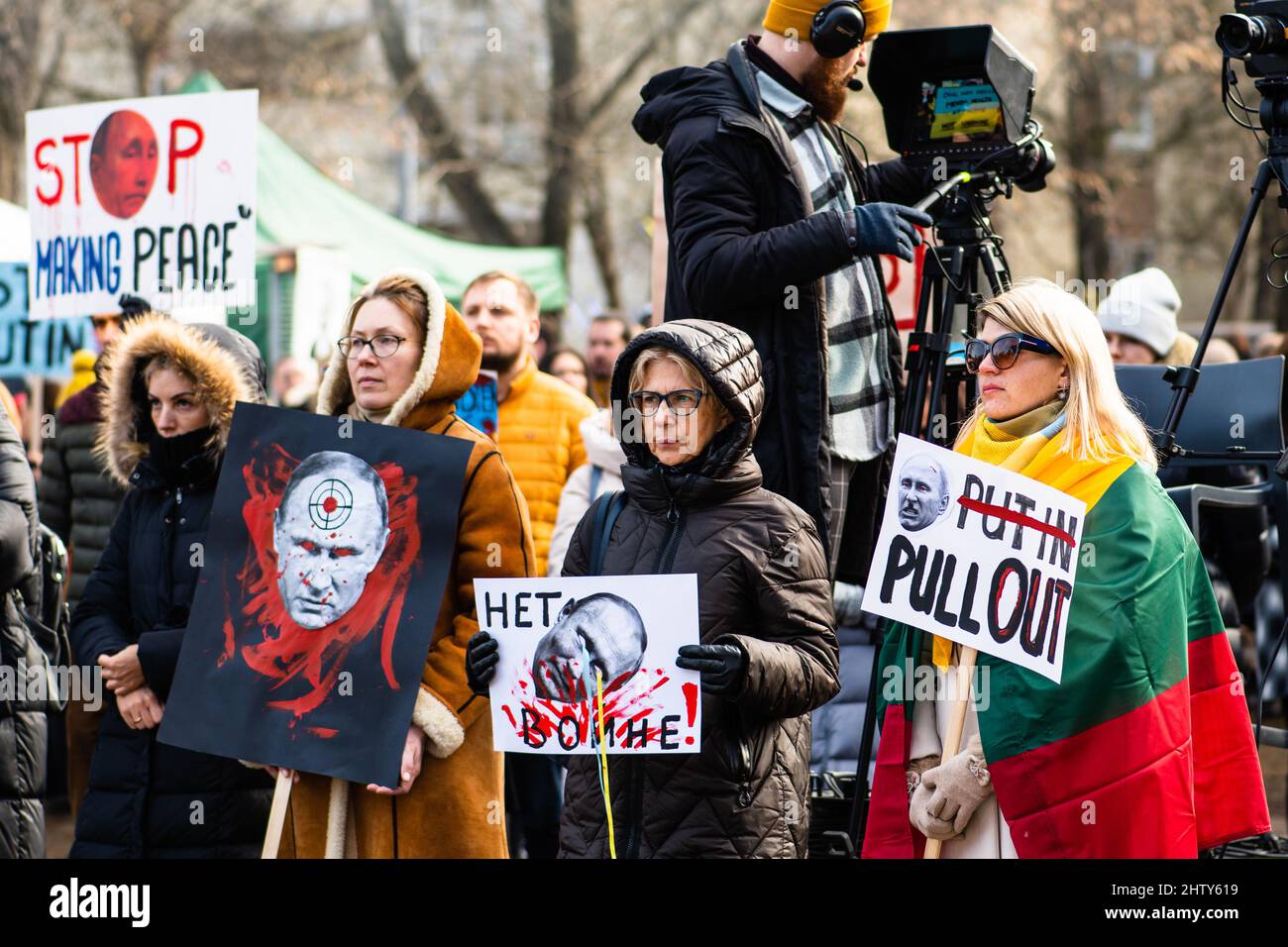 Girls during a peaceful demonstration against war, Putin and Russia in support of Ukraine, with people, placards and flags. Stop War Stock Photo