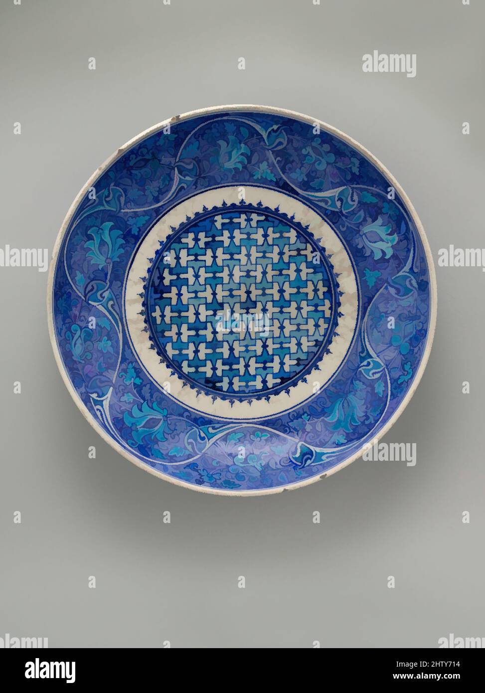 Art inspired by Dish, mid-16th century, Made in Turkey, Iznik, Stonepaste; painted in turquoise and two hues of blue under transparent glaze, H. 3 in. (7.62 cm), Ceramics, Classic works modernized by Artotop with a splash of modernity. Shapes, color and value, eye-catching visual impact on art. Emotions through freedom of artworks in a contemporary way. A timeless message pursuing a wildly creative new direction. Artists turning to the digital medium and creating the Artotop NFT Stock Photo