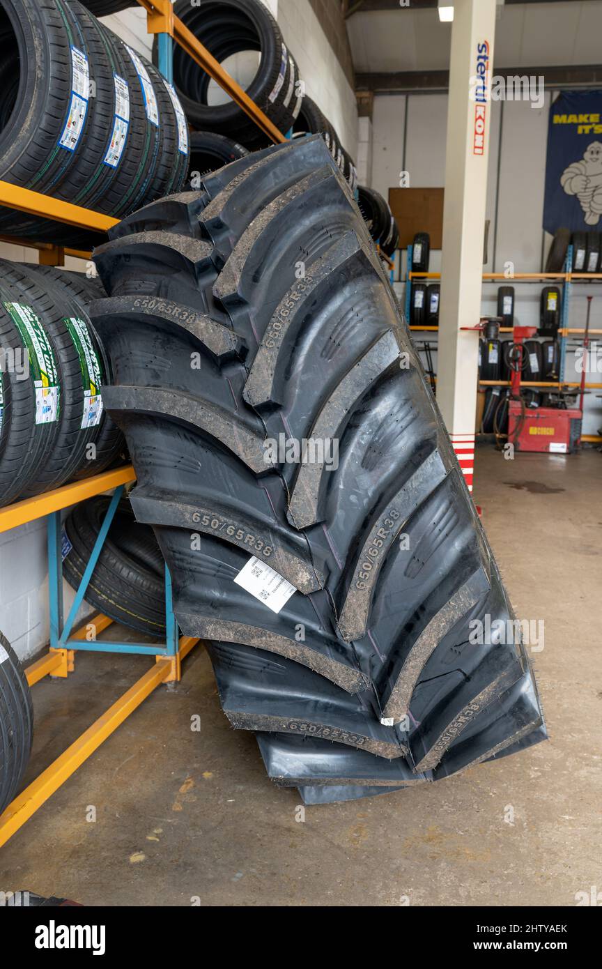 Large tractor tyre ready for sale at a tyre depot in Norfolk, UK Stock