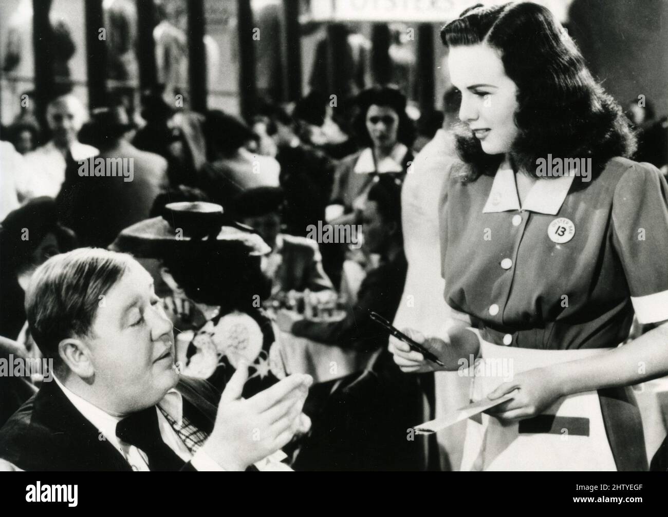 Actress Deanna Durbin and Charles Laughton in the movie Because of Him, USA 1946 Stock Photo